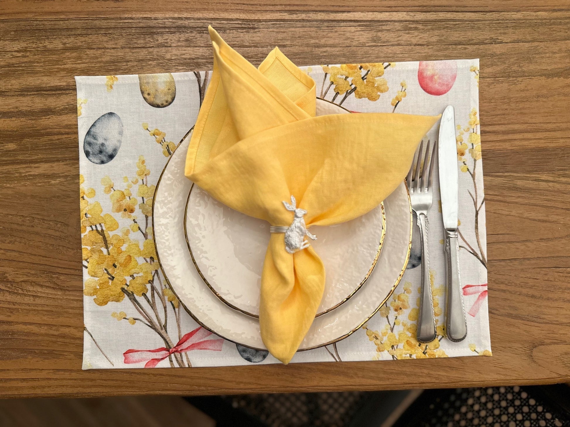 Elevate Your Dining Experience with the Easter Happy Placemat by Hortensias Home at www.brixbailey.com