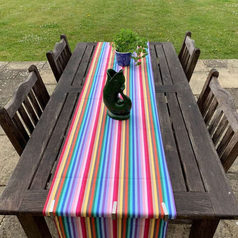 Luxury rainbow table runner, 100% cotton recycled organic yarn, handcrafted in England, stylish 2.5m long, best-selling party decor by Maison Elhoria at brixbailey.com