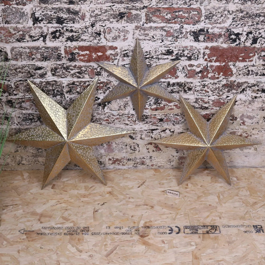 Luxury Tara Trio gold star wall art set, premium distressed metal celestial decor, stylish vintage-inspired home accents by Maravi at brixbailey.com