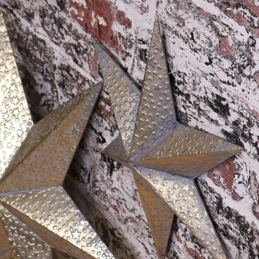 Tara Trio gold star wall art set, luxury distressed metal stars, vintage celestial home decor, best-selling rustic wall accents by Maravi at brixbailey.com