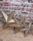 Luxury Tara Trio gold star wall art set, distressed vintage metal stars for home decor, celestial rustic elegance by Maravi at brixbailey.com