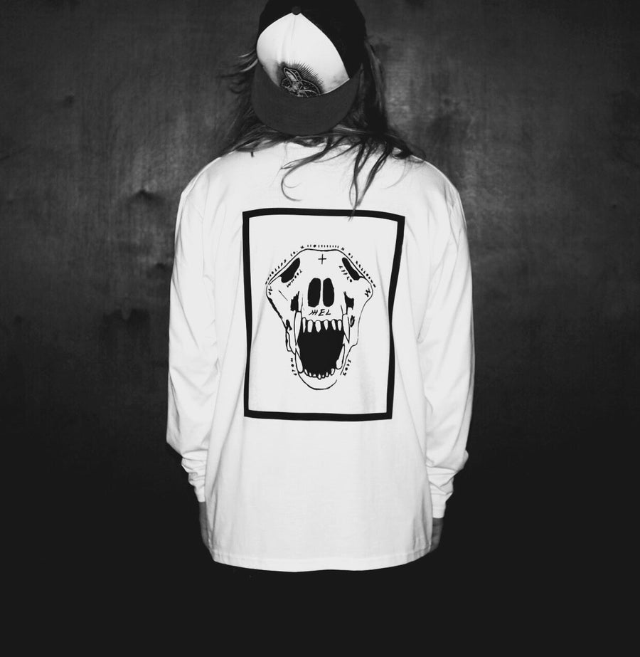 Luxury oversized white long sleeve with handprinted WWOOLLFF CO graphics, premium organic cotton, stylish unisex design by WWOOLLFF CO. at brixbailey.com