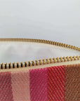 Premium rainbow toiletry bag, luxury British woven organic cotton, waterproof lining, durable zip, versatile for baby essentials or travel by Maison Elhoria at brixbailey.com