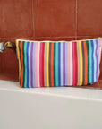 Premium rainbow toiletry bag, luxury British woven organic cotton, waterproof lining, sturdy zip, versatile for baby essentials, washable recycled yarns by Maison Elhoria at brixbailey.com