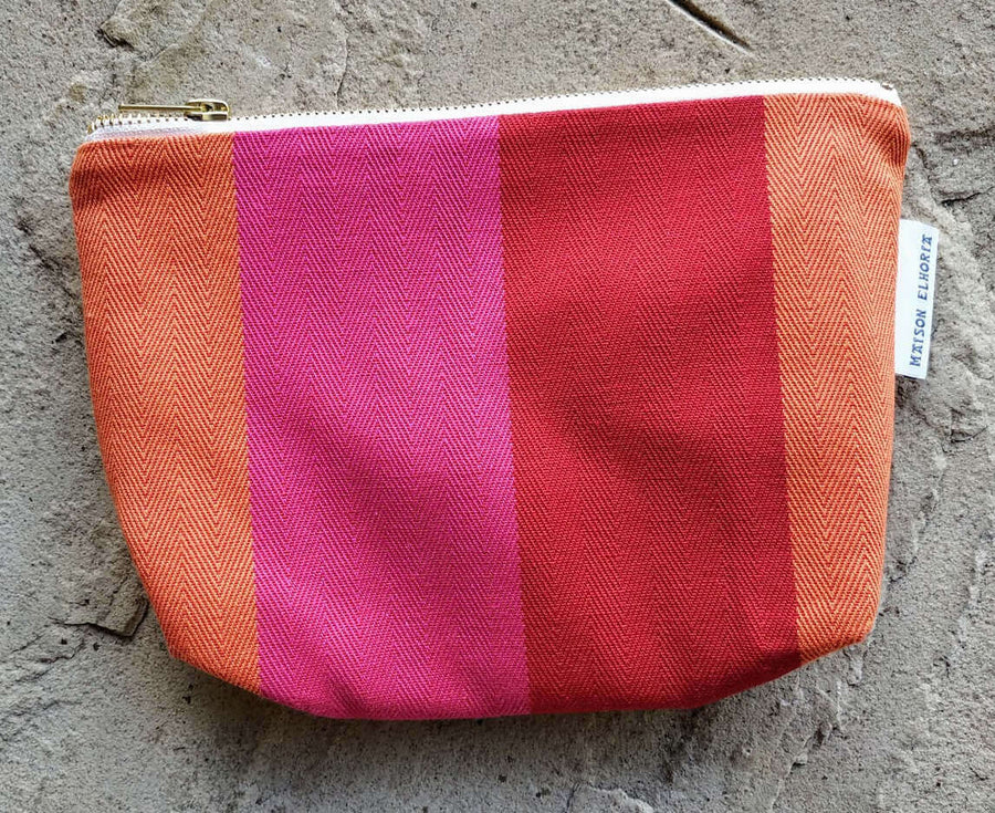 Premium British-made red orange pink toiletry bag, stylish waterproof zip organizer with herringbone stripes, 8 inches compact by Maison Elhoria at brixbailey.com