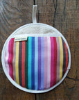 Rainbow pot grab, round oven glove, heat-resistant, handcrafted in UK, premium recycled organic yarns, stylish kitchen accessory by Maison Elhoria at brixbailey.com