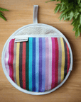 Rainbow pot grab, round oven glove, best-selling heat-resistant handcrafted UK kitchen accessory for hot pots and pans by Maison Elhoria at brixbailey.com