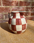 Checkered ceramic pitcher