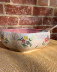 Floral salad bowl, with serving utensils