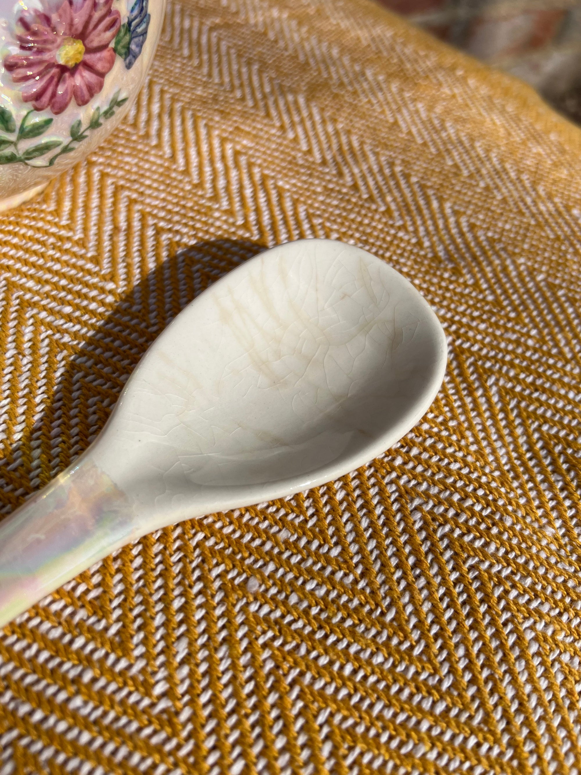 Floral salad bowl, with serving utensils