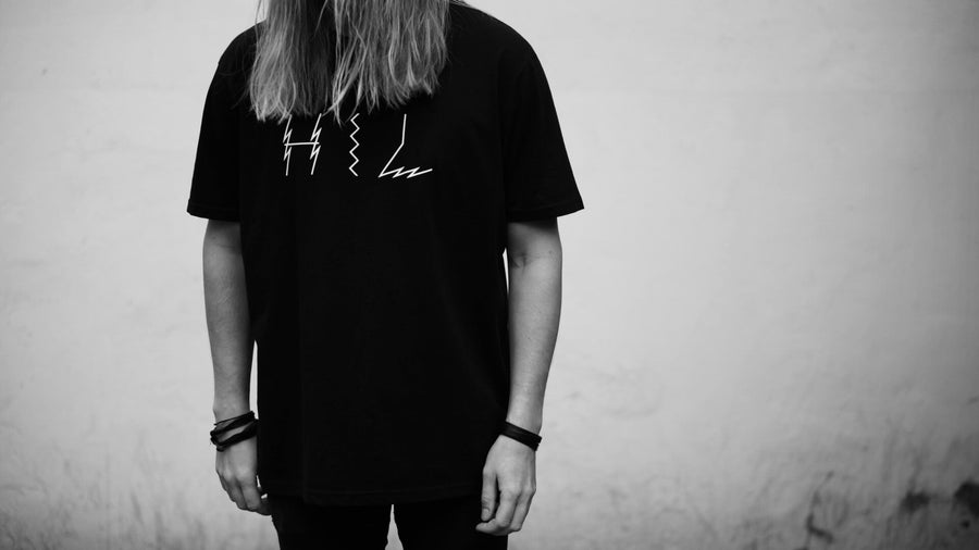 Limited edition black organic cotton tee, handprinted in Helsinki, premium unisex extra large fit, luxury sustainable design by WWOOLLFF CO. at brixbailey.com