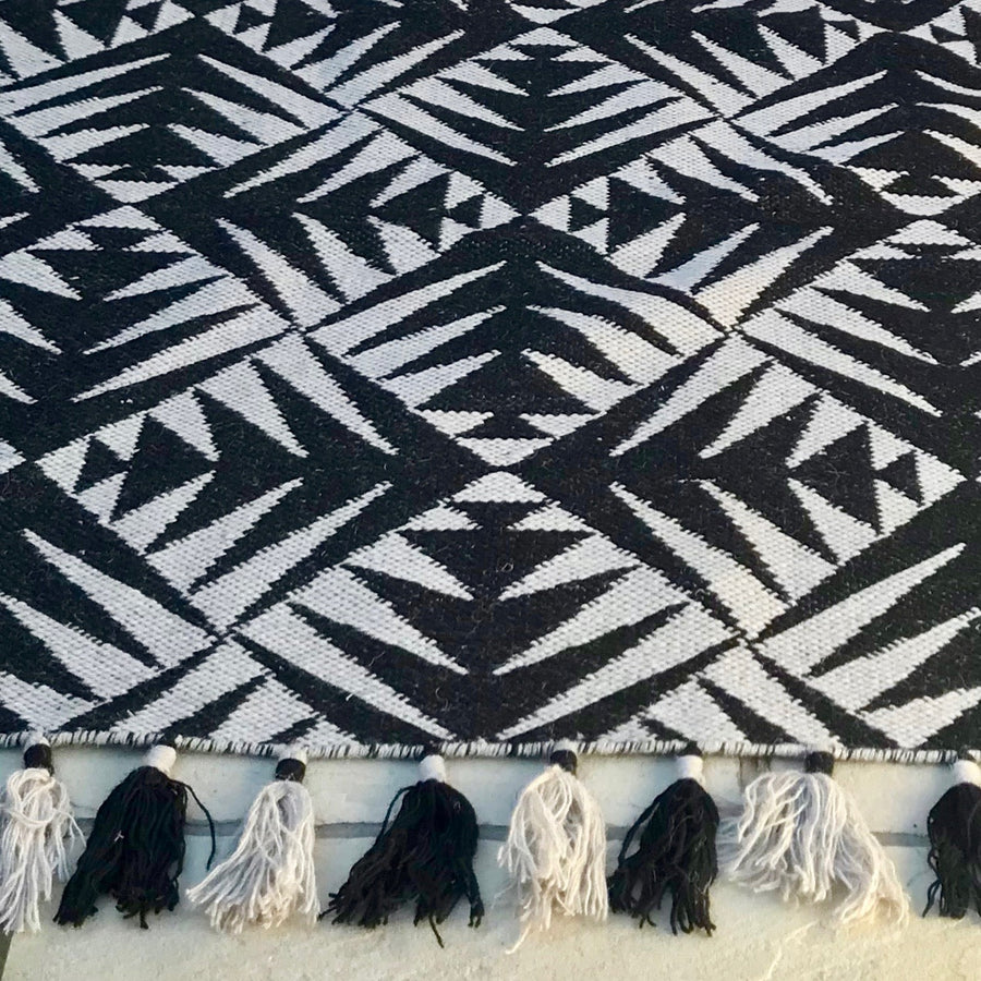 Luxury monochrome flat weave rug, handmade in India, pure wool geometric design with tassels, 170x240cm, best-selling contemporary style by Maria Starling Design at brixbailey.com