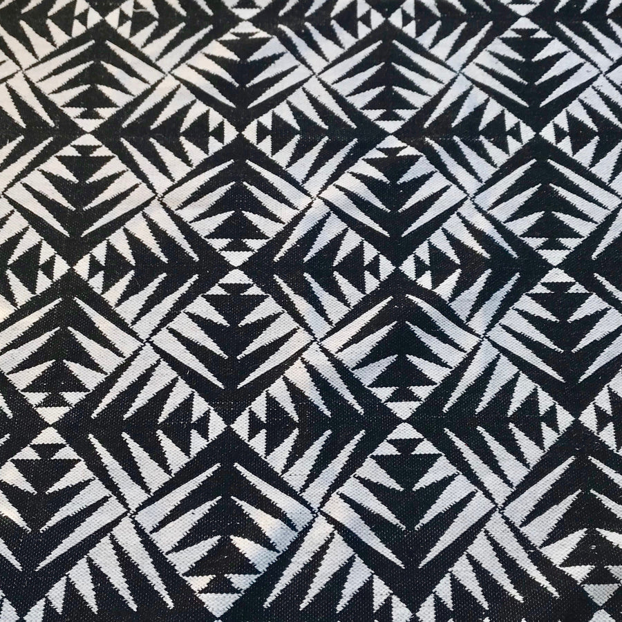 Luxury monochrome flat weave rug, handmade in India, premium pure wool, stylish geometric design, large edge tassels, best-selling contemporary ethnic decor by Maria Starling Design at brixbailey.com