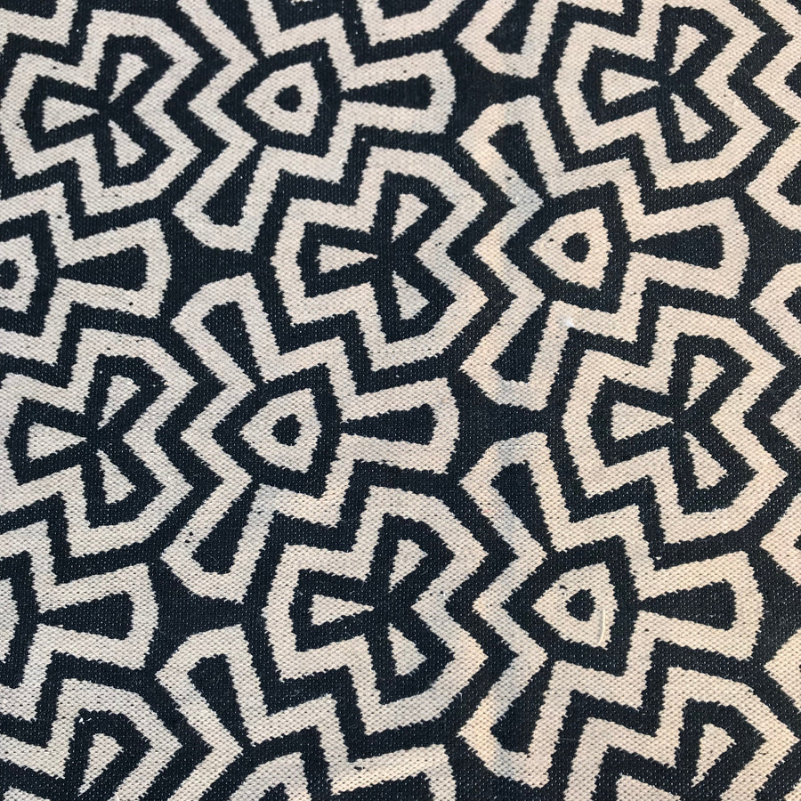 Luxury flat weave rug, monochrome geometric design, handmade wool rug, stylish contemporary ethnic decor, premium tassel edge, best-selling by Maria Starling Design at brixbailey.com