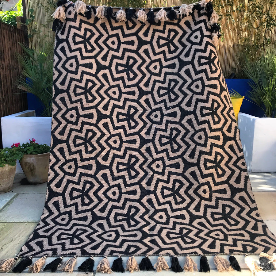Luxury monochrome flat weave wool rug, handmade in India, stylish geometric design with tassels, best-selling neutral tones by Maria Starling Design at brixbailey.com