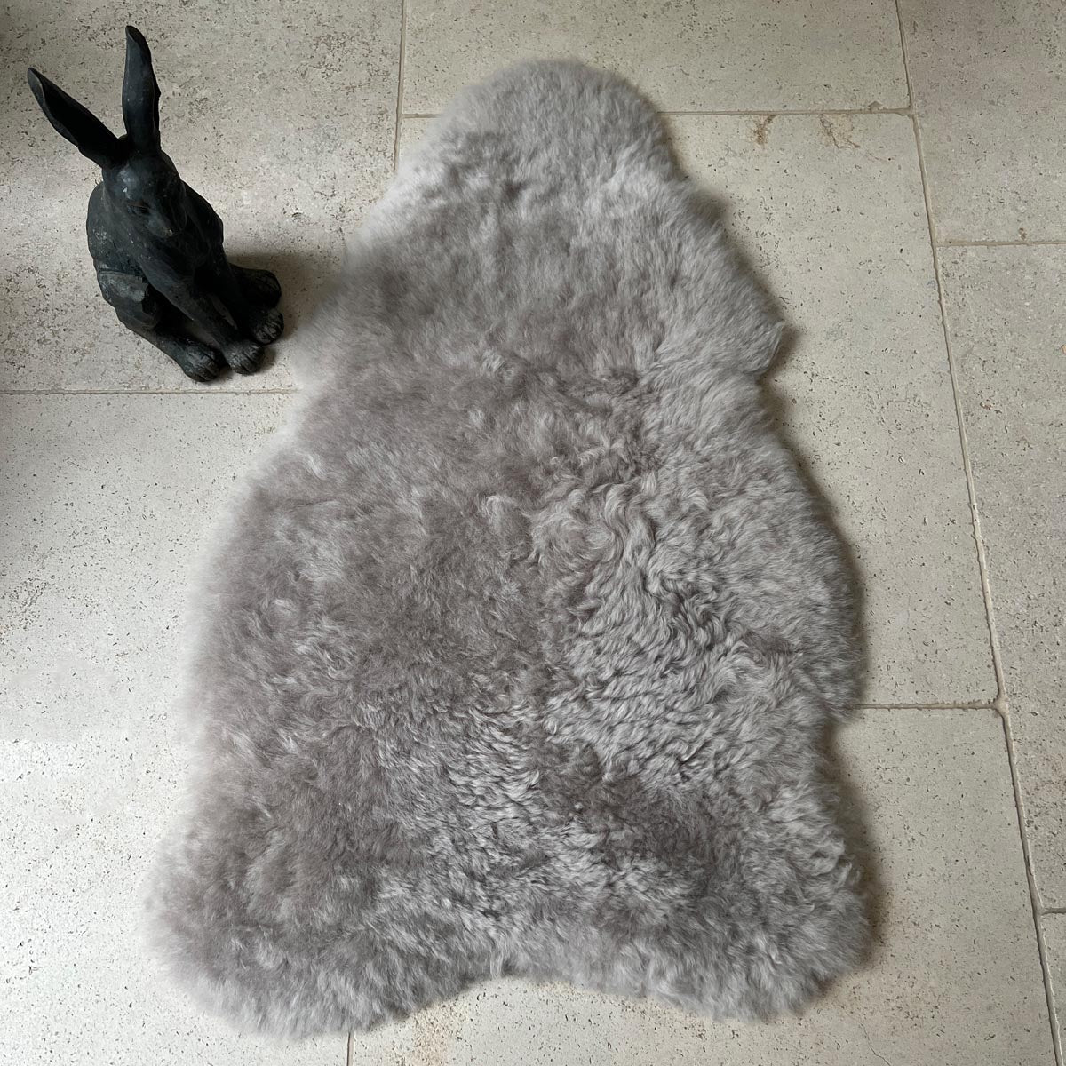 Premium Icelandic sheepskin throw in dove grey, large luxury sheepskin rug, best-selling shorn sheepskin, handcrafted and sustainable by Wildash London at brixbailey.com
