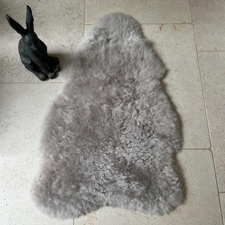 Premium Icelandic sheepskin throw in dove grey, large luxury sheepskin rug, best-selling shorn sheepskin, handcrafted and sustainable by Wildash London at brixbailey.com
