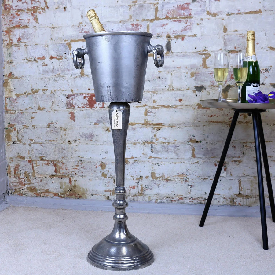 Luxury vintage floor standing champagne ice bucket, distressed silver aluminium, elegant champagne cooler for bars, restaurants, upscale events by Maravi at brixbailey.com