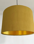 Mustard velvet drum lampshade/ ceiling shade with a metallic brushed gold lining