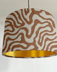 Sandstone wiggle drum lampshade/ ceiling shade with a metallic brushed gold lining