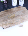 Premium Takli serving chopping board on legs, sustainable mango wood, elevated design, stylish kitchen accessory, best-selling by Maravi at brixbailey.com