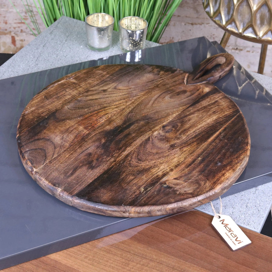 Amba rustic round wooden serving board, premium mango wood, stylish charcuterie cheese platter, handcrafted kitchen dining accessory by Maravi at brixbailey.com