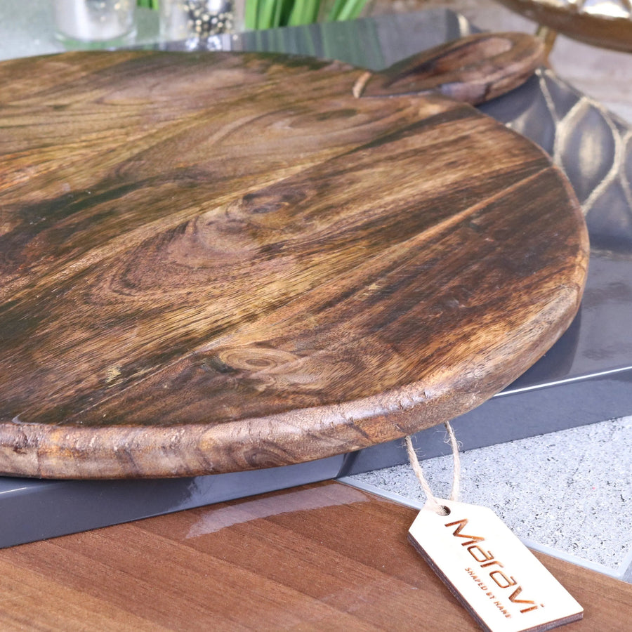 Amba premium round wooden serving board, luxury mango wood charcuterie board, stylish rustic kitchen serving tray by Maravi at brixbailey.com