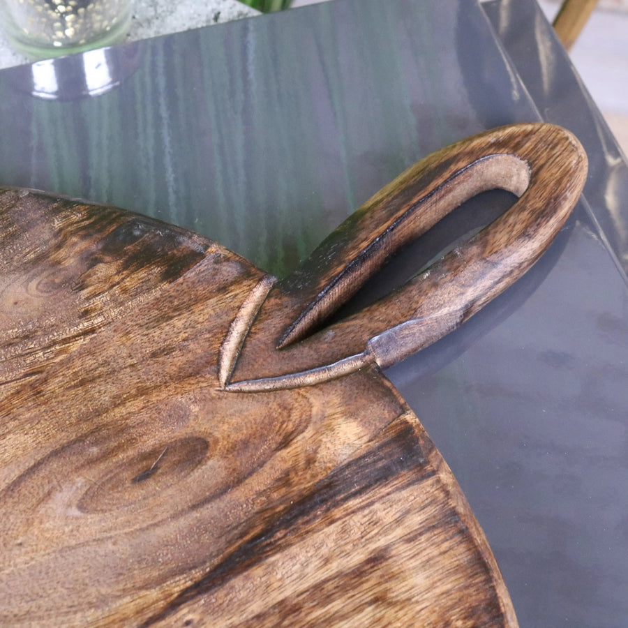 Premium Amba round wooden serving board, luxury mango wood with rustic handle, stylish charcuterie cheese tray by Maravi at brixbailey.com