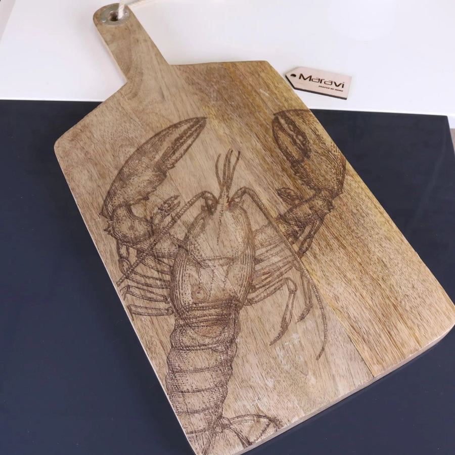 Luxury handcrafted lobster and fish serving platter board, premium mango wood with intricate coastal engravings, stylish kitchenware by Maravi at brixbailey.com