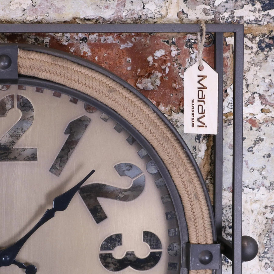 Premium industrial wall clock, rugged metal frame with laser-cut face, vintage-inspired hands, stylish home office decor by Maravi at brixbailey.com