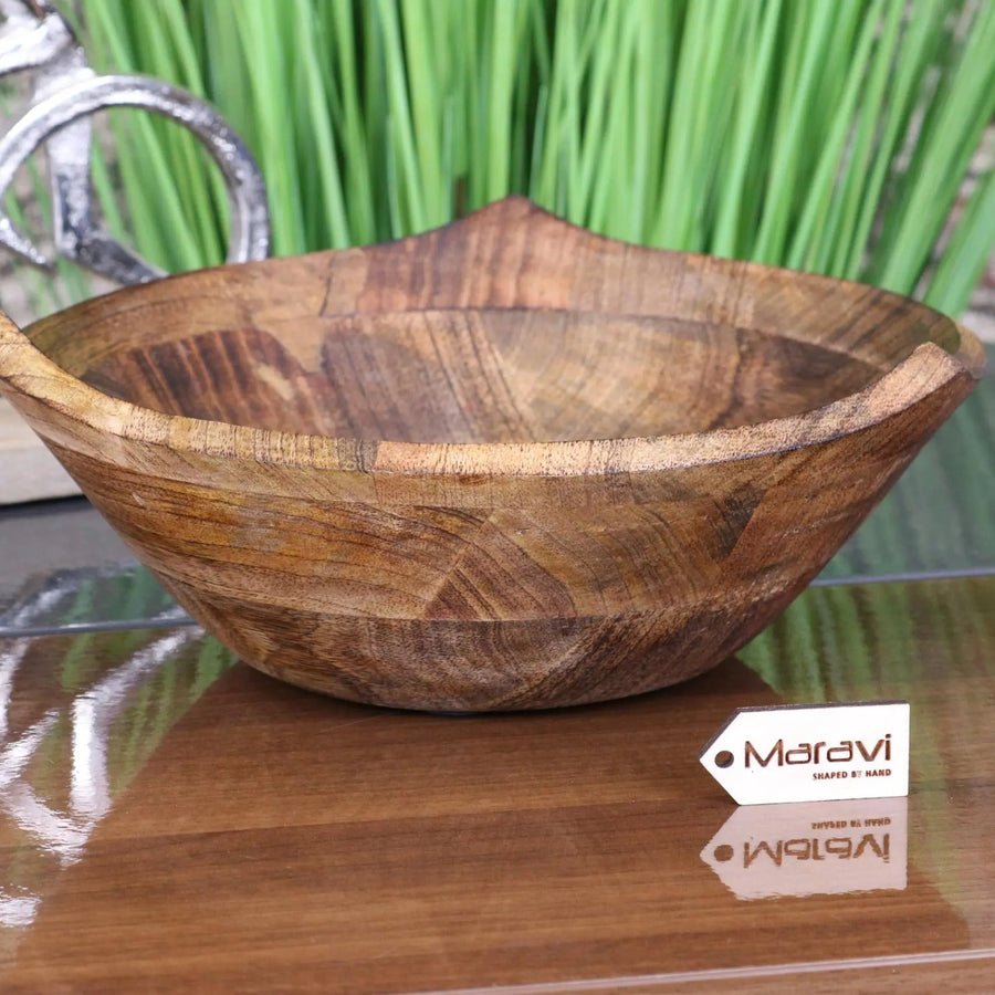Luxury large wooden fruit bowl, handcrafted mango wood with unique three-point design, stylish kitchen decor, best-selling rustic serving bowl by Maravi at brixbailey.com