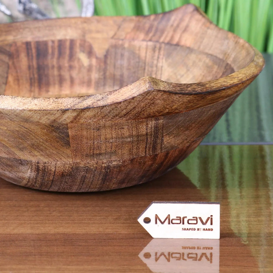 Luxury large wooden fruit bowl, handcrafted mango wood with three-point rim design, stylish kitchen decor, best-selling rustic serving bowl by Maravi at brixbailey.com