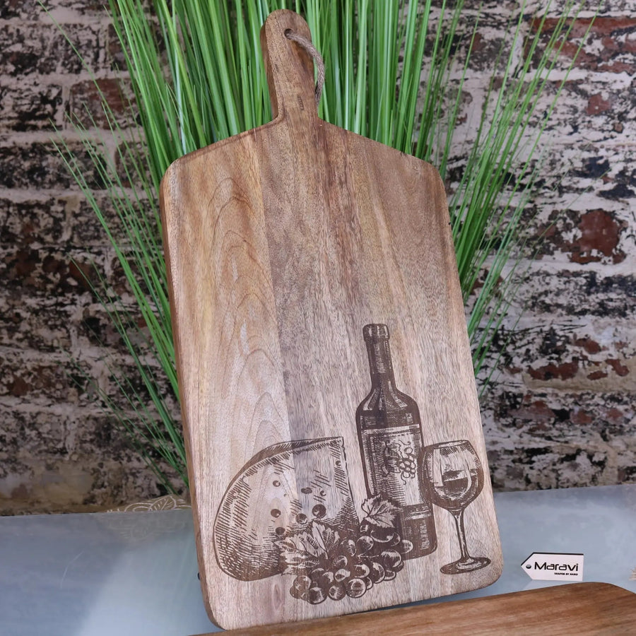 Luxury wooden serving board, elegant cheese and wine theme, handcrafted mango wood, stylish dining accessory, best-selling kitchen gift by Maravi at brixbailey.com