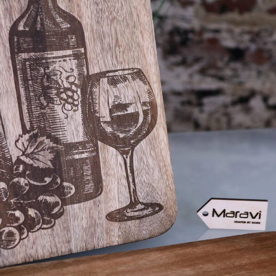 Premium wooden serving board with cheese and wine laser engraving, elegant mango wood charcuterie board for stylish dining by Maravi at brixbailey.com