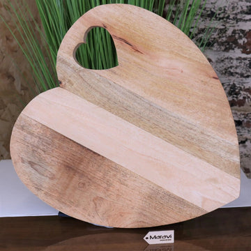 Luxury Dili heart shaped chopping board, premium mango wood with rustic burnt finish, elegant serving and cutting board for kitchen by Maravi at brixbailey.com