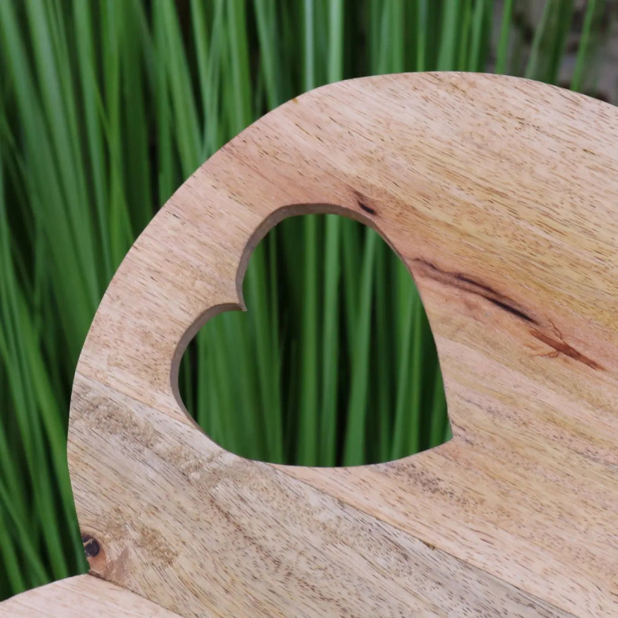 Dili heart shape chopping board, premium mango wood, stylish rustic burnt finish, best-selling kitchen essential, elegant serving and cutting board by Maravi at brixbailey.com