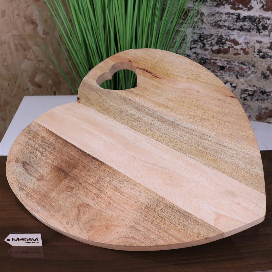 Dili heart shape chopping board, premium mango wood, stylish rustic burnt finish, best-selling kitchen accessory, elegant serving board by Maravi at brixbailey.com