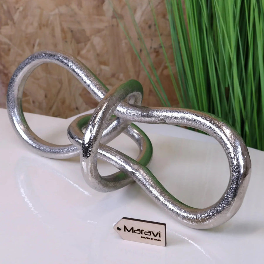 Luxury aluminum knot sculpture, premium distressed silver finish, modern abstract art decor, handcrafted home office ornament, best-selling artistic centerpiece by Maravi at brixbailey.com