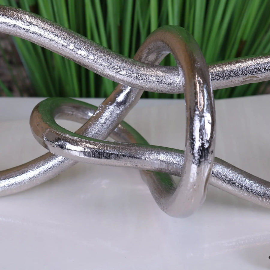 Luxury distressed silver aluminum knot sculpture, premium handcrafted modern art decor for home or office by Maravi at brixbailey.com