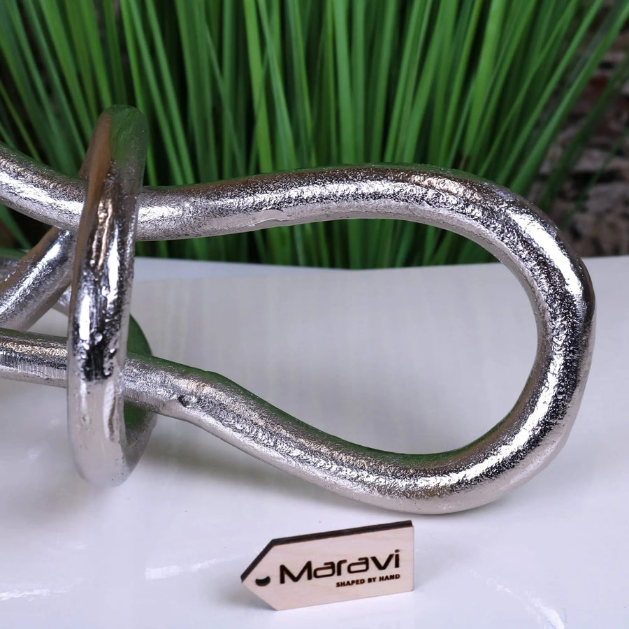 Luxury aluminum knot sculpture, modern distressed silver art piece, handcrafted premium home decor, best-selling abstract ornament by Maravi at brixbailey.com