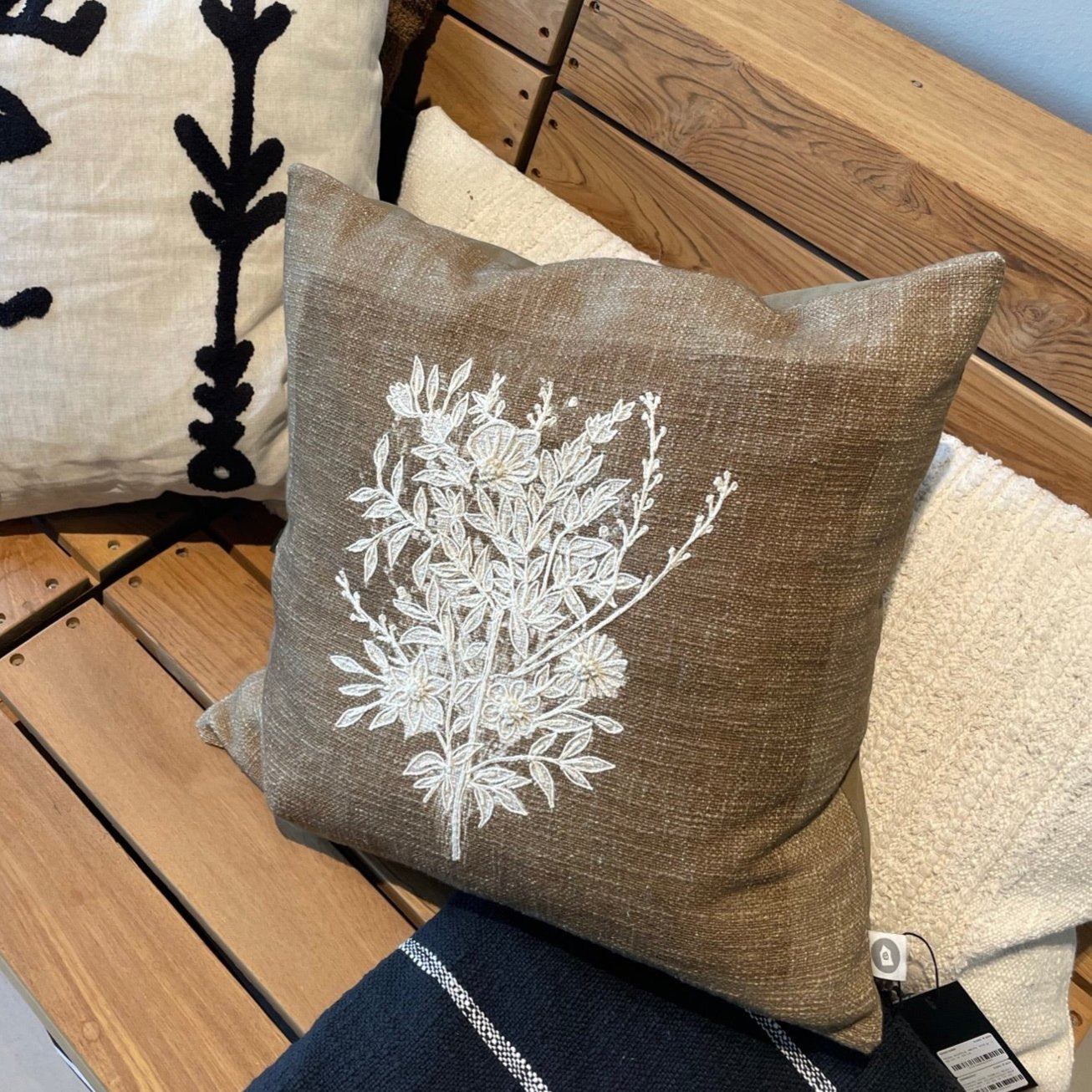 Luxury Ila cushion in olive brown cotton with hand-embroidered floral design, stylish home decor accent by Ella James at brixbailey.com