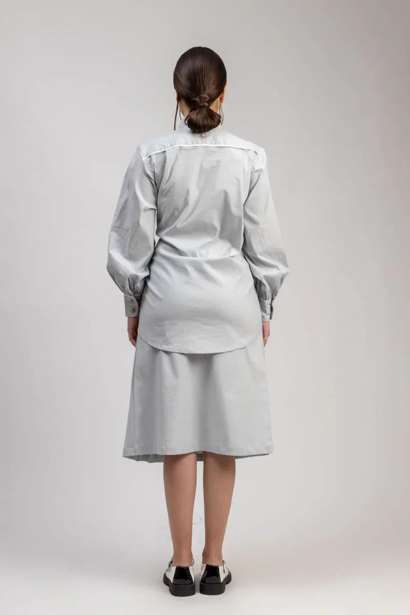 Luxury oversized ice blue shirt with tie-up detailing, upcycled cotton linen, stylish and comfortable, best-selling Kate Blue shirt by Bethikal at brixbailey.com