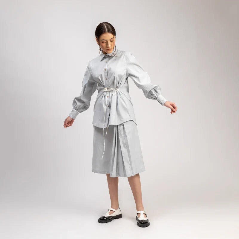 Luxury oversized ice blue shirt with tie-up detailing, upcycled cotton linen, comfortable fit, handcrafted from factory waste by Bethikal at brixbailey.com