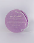 Luxury Solidarity soy candle with lilac buds, green leaves, cool earth, handcrafted in Illinois, premium fragrance, resilience glass vessel by Labyrinth Made Goods at brixbailey.com
