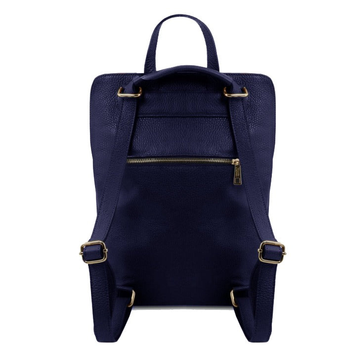 a playful navy leather backpack on a sunny park bench, ready for a spontaneous adventure