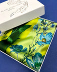 Vibrant yellow and pale blue ‘Luciferin’ floral silk scarf