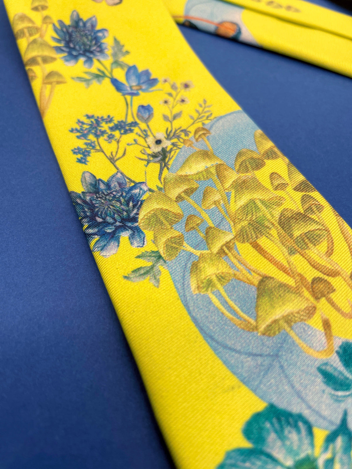 Vibrant yellow and pale blue ‘Luciferin’ floral silk tie