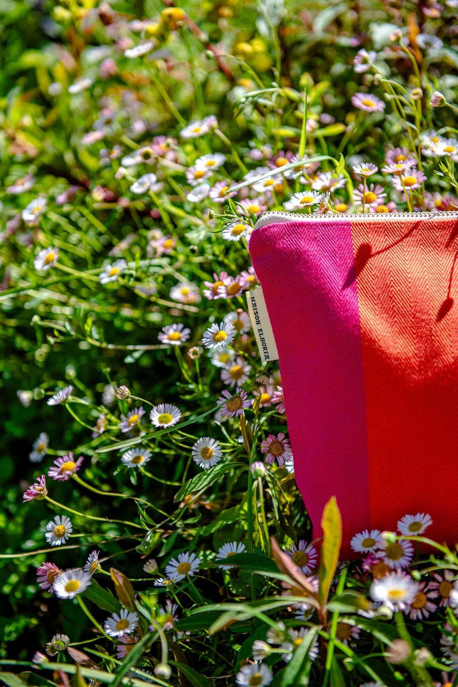 Premium British-made zip toiletry bag, red orange pink herringbone stripes, organic cotton, waterproof lining, compact 8 inches by Maison Elhoria at brixbailey.com