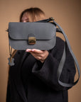 Classic Cut Saddle Bag by Zelma Kraft – Elegant & Versatile by Zelma Kraft at brixbailey.com