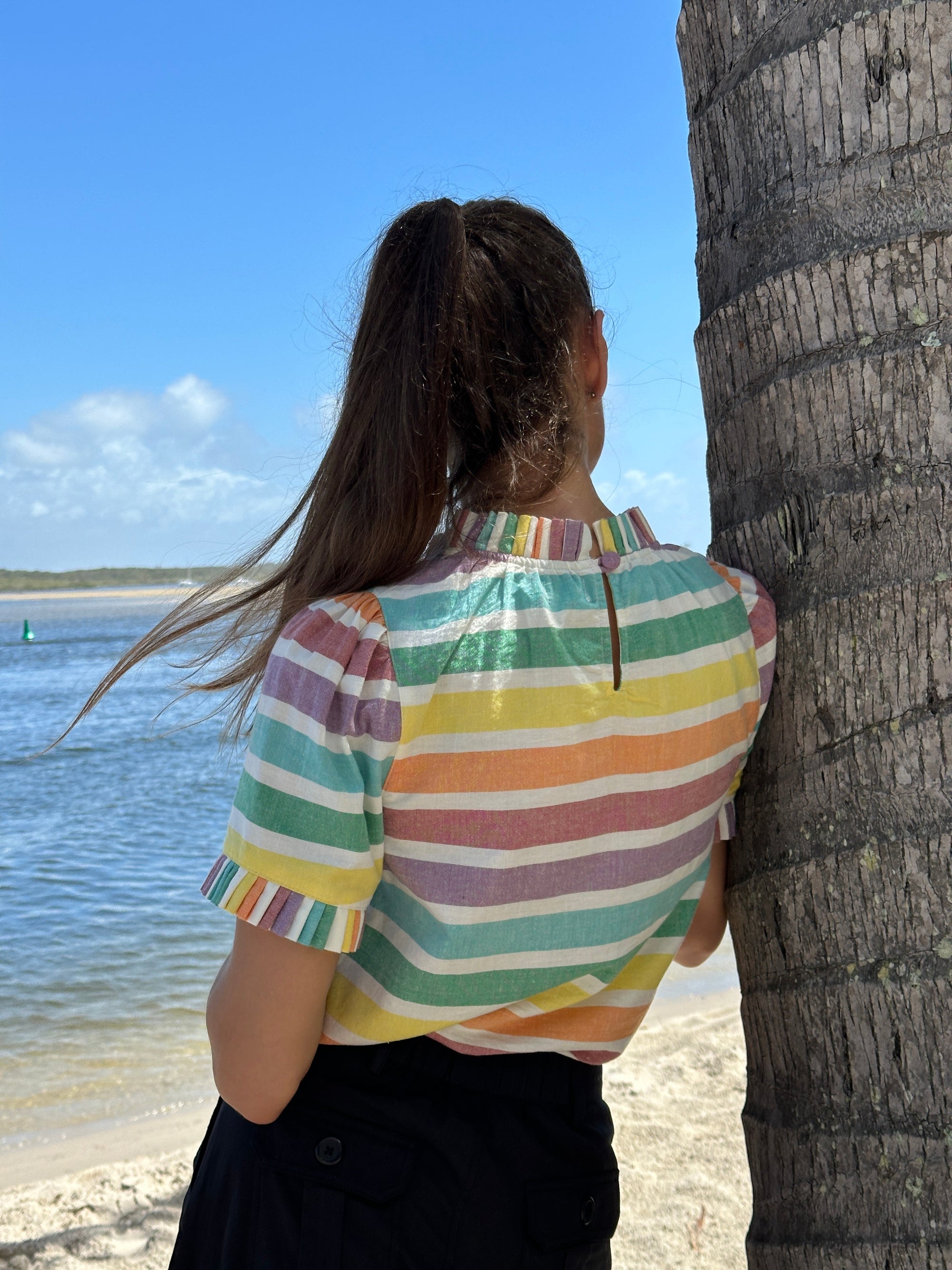 Luxury puff shoulder rainbow stripe cotton top with pleated neck and sleeve details by GILD at brixbailey.com